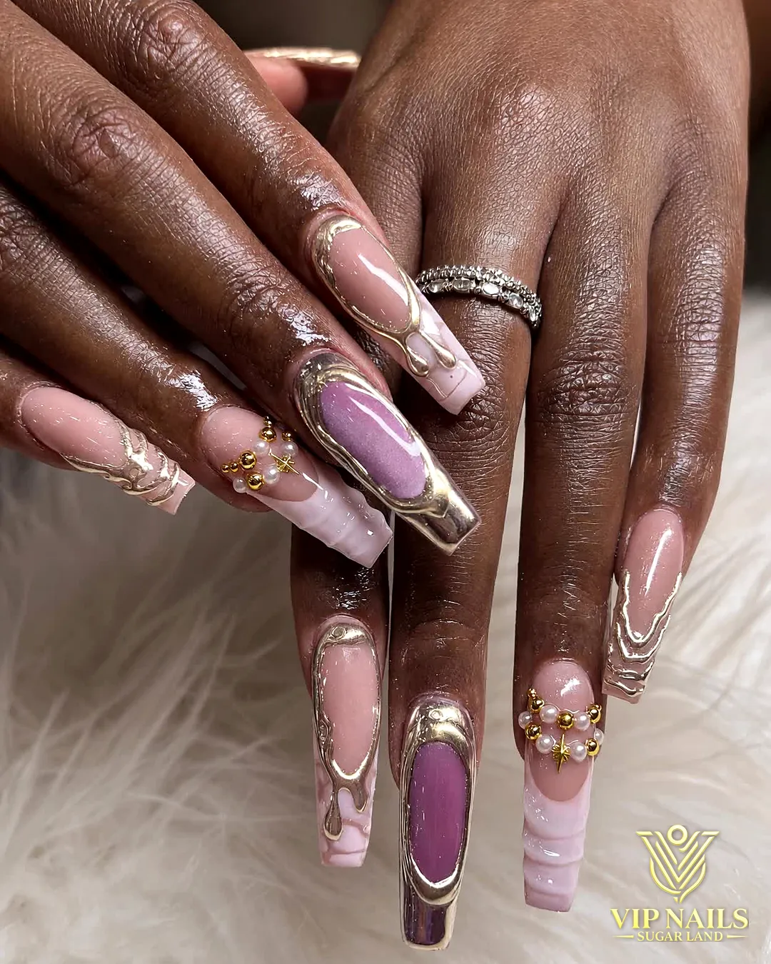 Long nude and pink coffin acrylic set with gold chrome art by VIP Nails Sugar Land