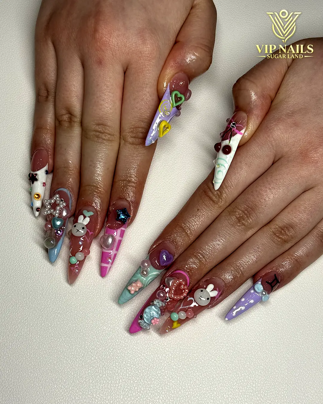 Long coffin acrylic set with heavy crystal bling by VIP Nails Sugar Land
