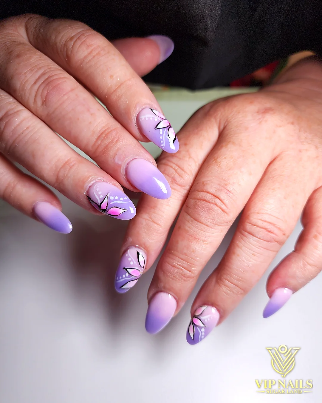 Lavender almond nails with hand-drawn line art by VIP Nails Sugar Land