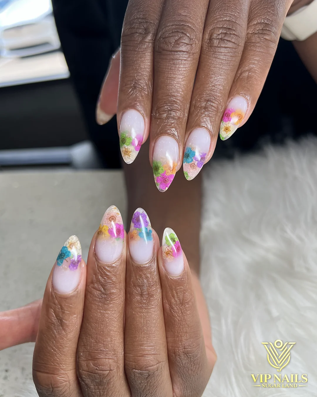 Medium almond nails with hand-painted multicolor drip art by VIP Nails Sugar Land