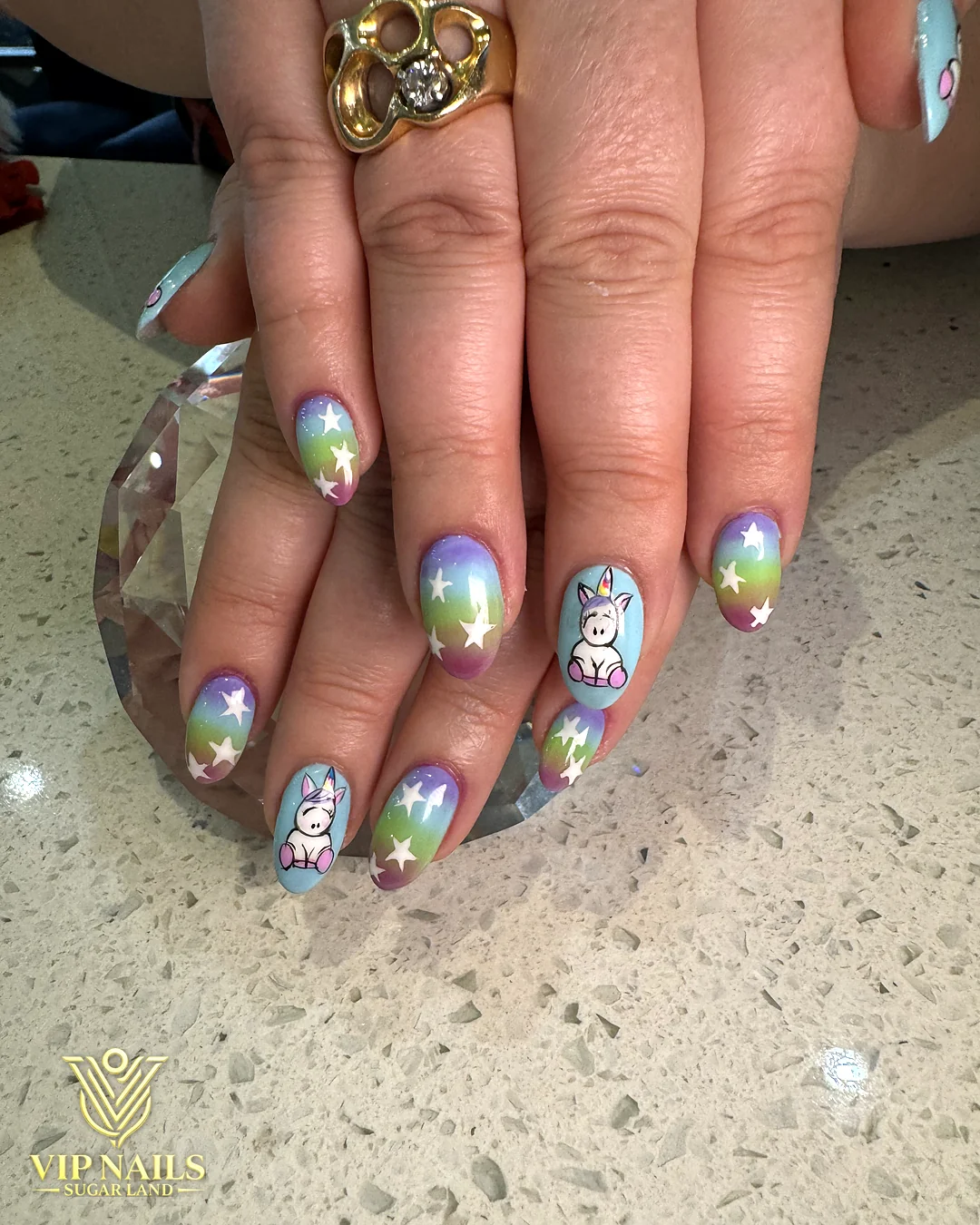 Short nails with hand-painted multicolor art accents by VIP Nails Sugar Land