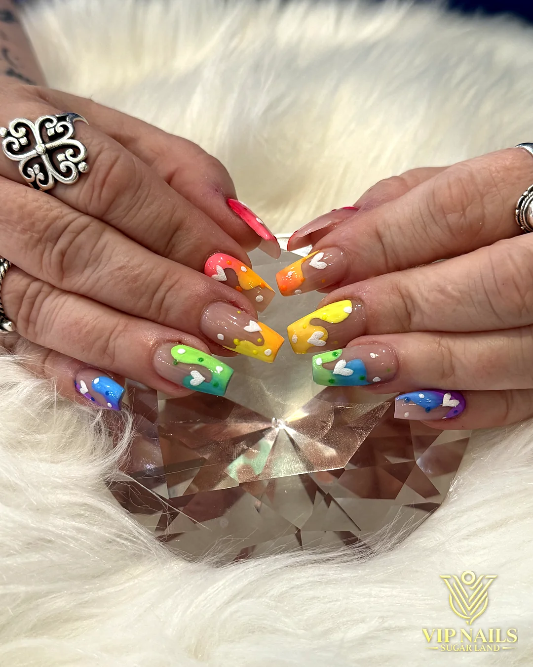 Short natural nails with hand-painted rainbow tips by VIP Nails Sugar Land