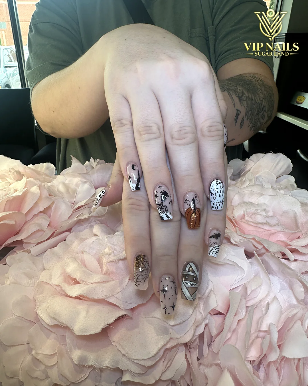 Short squoval nails with hand-drawn black and white art by VIP Nails Sugar Land