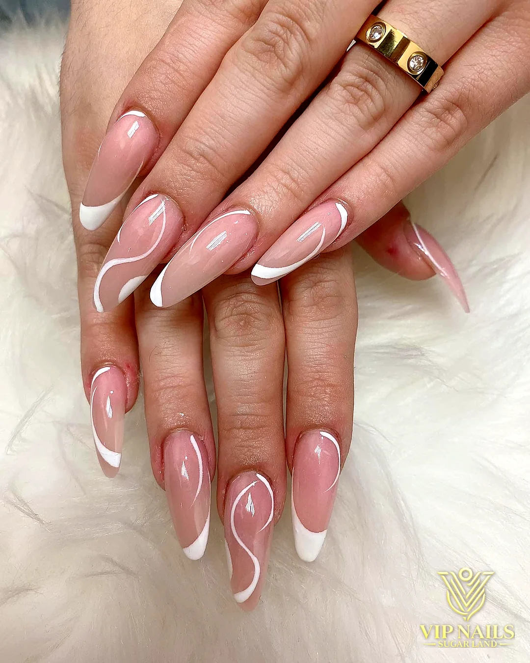 Long nude almond Gel X set with white swirl French tips by VIP Nails Sugar Land