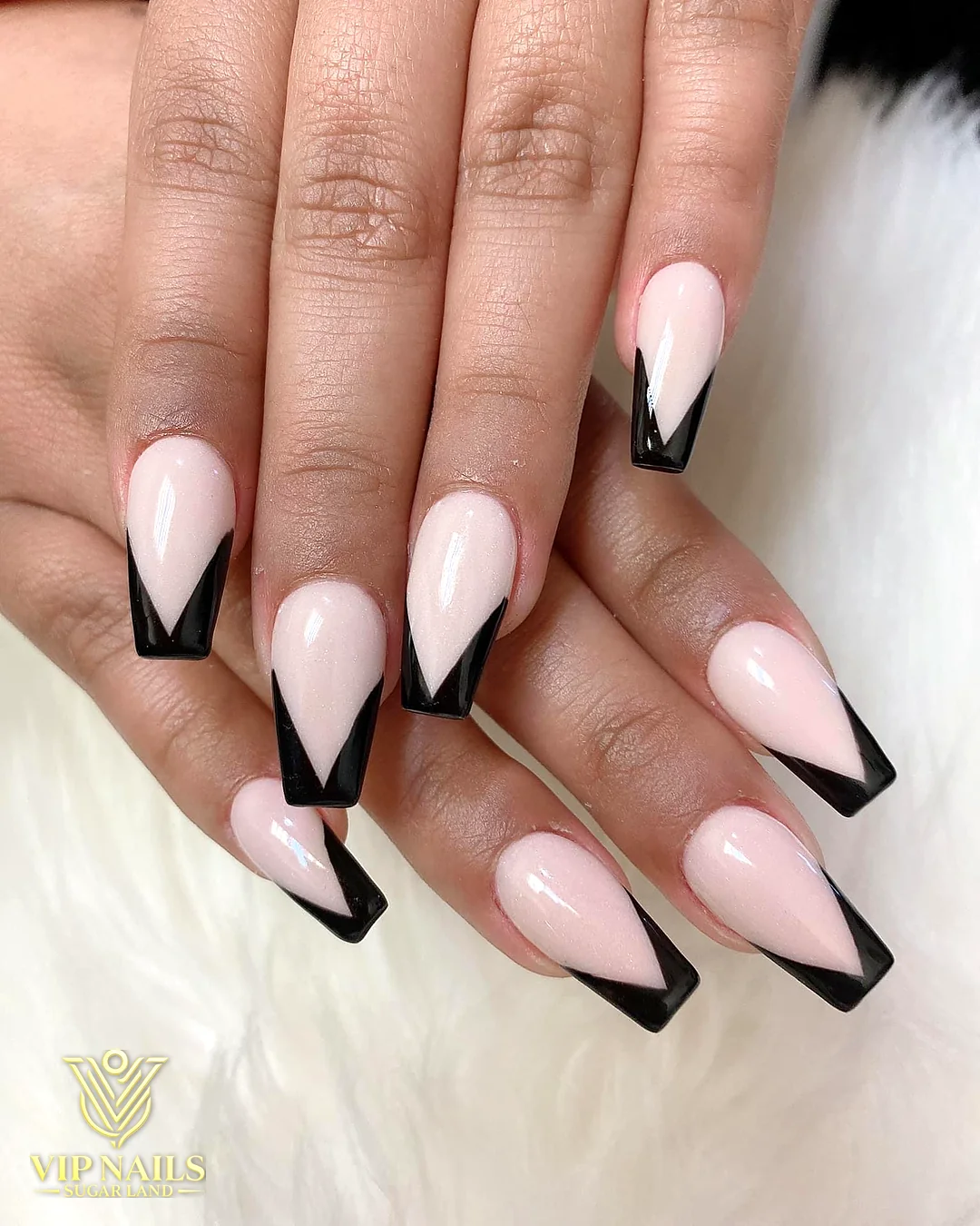 Long nude almond set with black V-French tips by VIP Nails Sugar Land