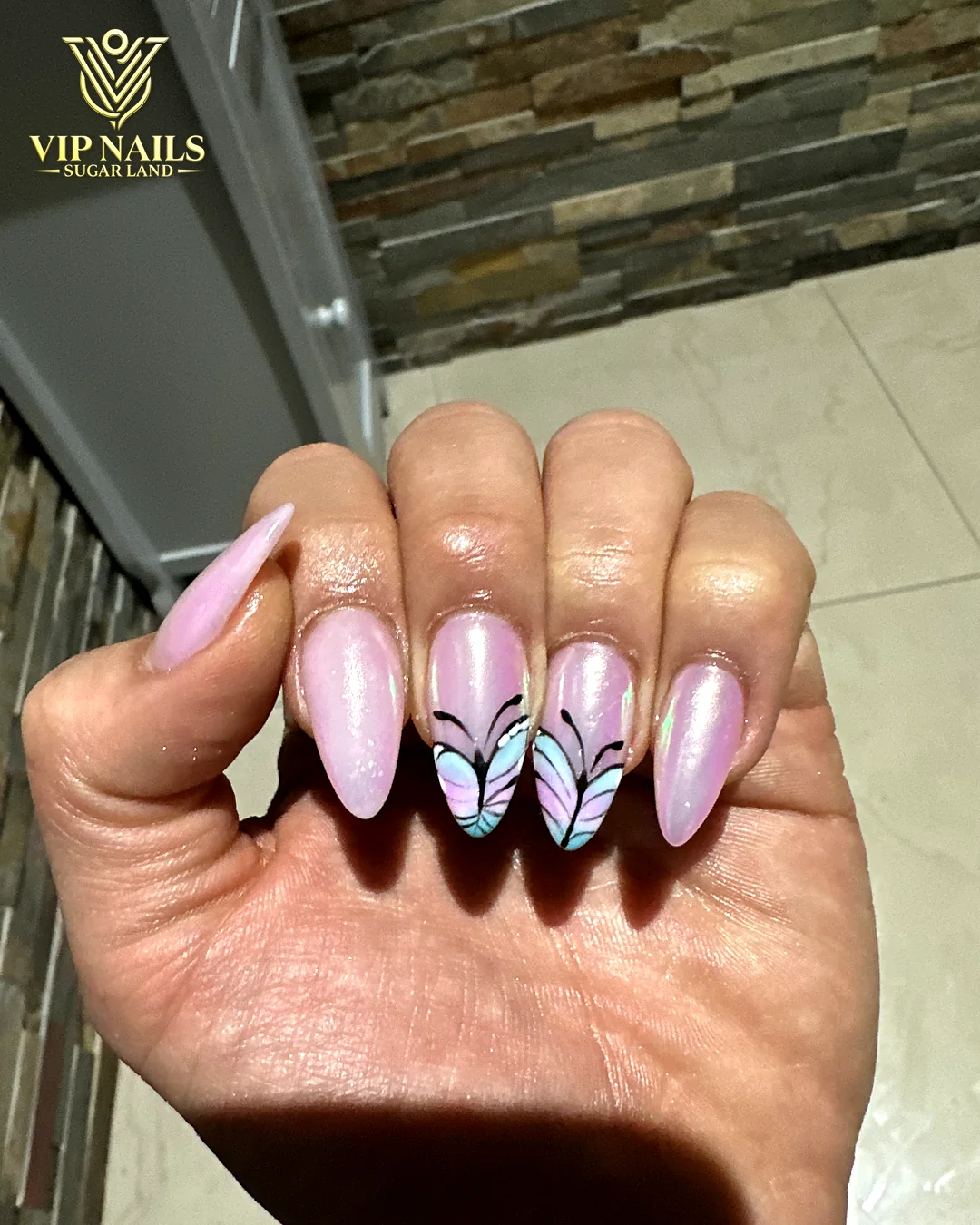 Lilac chrome almond set with butterfly accents by VIP Nails Sugar Land