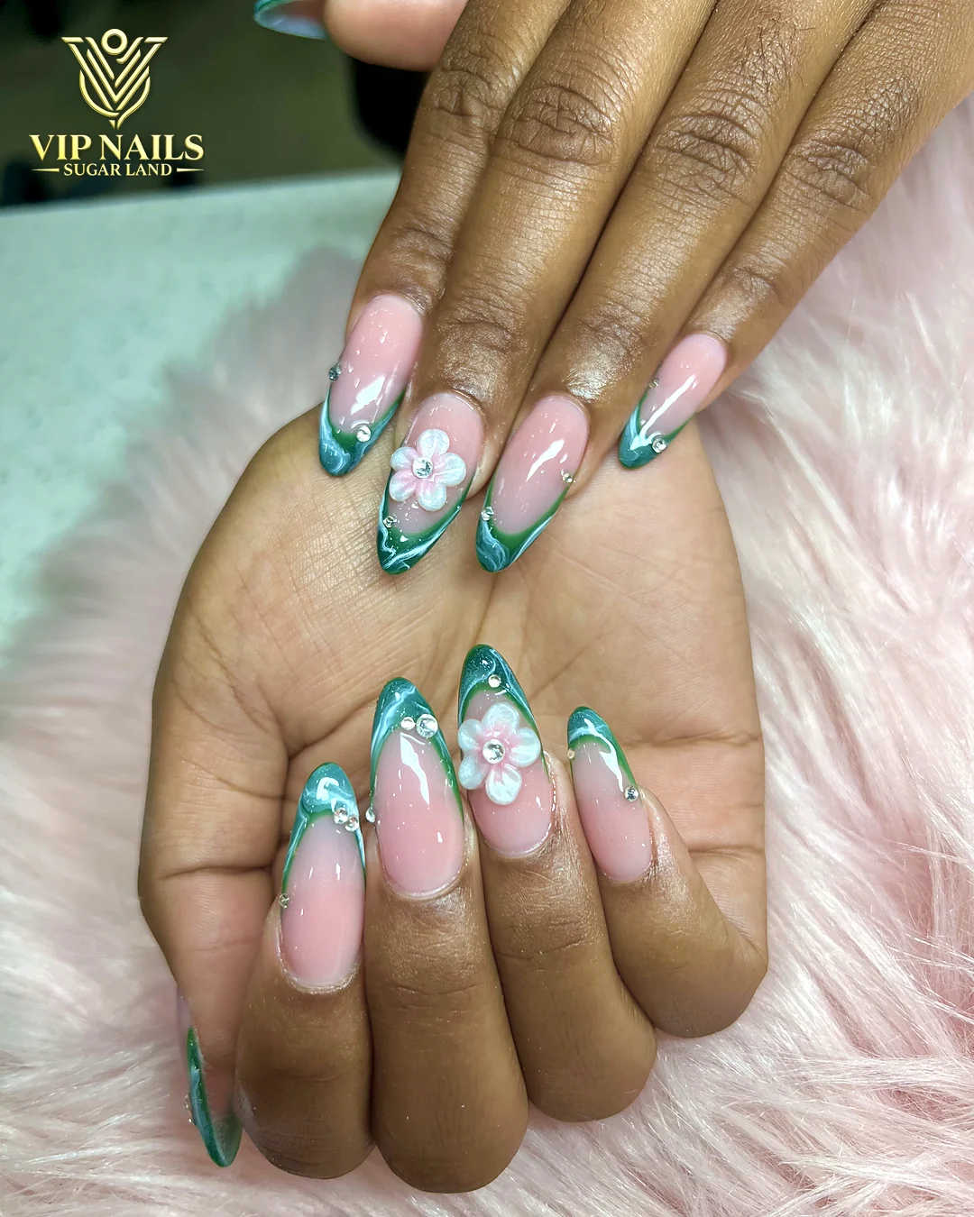 Teal French almond set with flower accents by VIP Nails Sugar Land